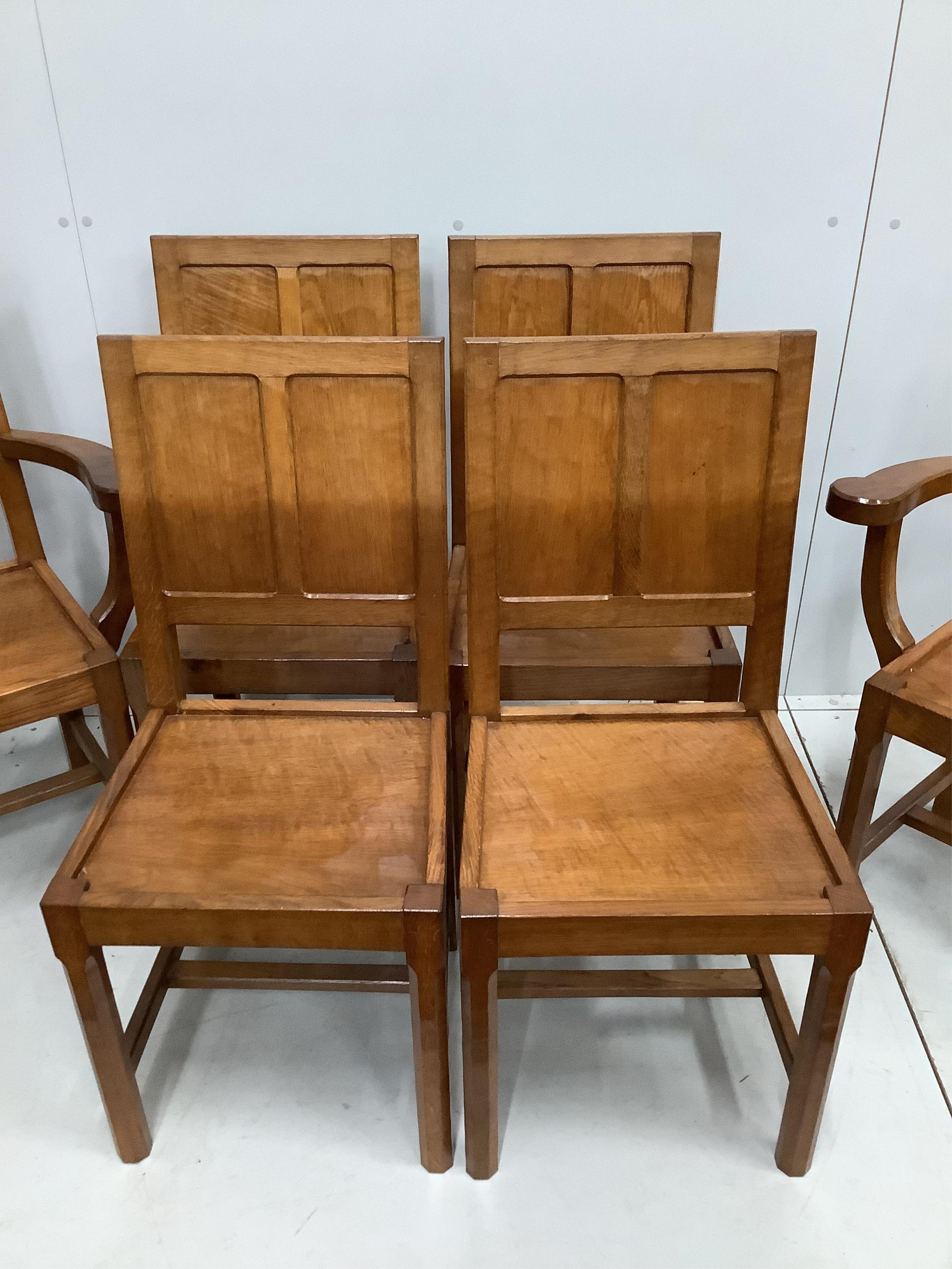 Alan Grainger 'Acorn Man', a set of six adzed oak panelled dining chairs, two with arms, largest width 66cm, depth 42cm, height 91cm. Condition - good